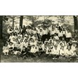 Etta Taube on a class outing, [192-]. Ontario Jewish Archives, Blankenstein Family Heritage Centre, item 4531.|This item is a photograph of a Lansdowne School class outing in Toronto. The photograph features a large group of kids assembled in a park. Etta Taube (m. Mrs. John Sherman) is pictured seated in the front row, second from the left.